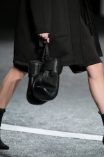 NEW YORK, NY - OCTOBER 16: A model (bag detail) walks the runway at the Alexander Wang X H&M Launch on October 16, 2014 in New York City. (Photo by Randy Brooke/Getty Images for H&M)
